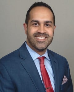 Headshot of Dr. Samir Singh smiling wearing a suit and tie